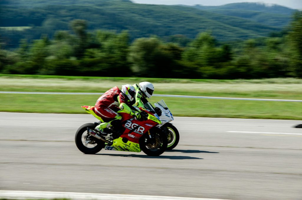 A man riding a motorcycle down a curvy road